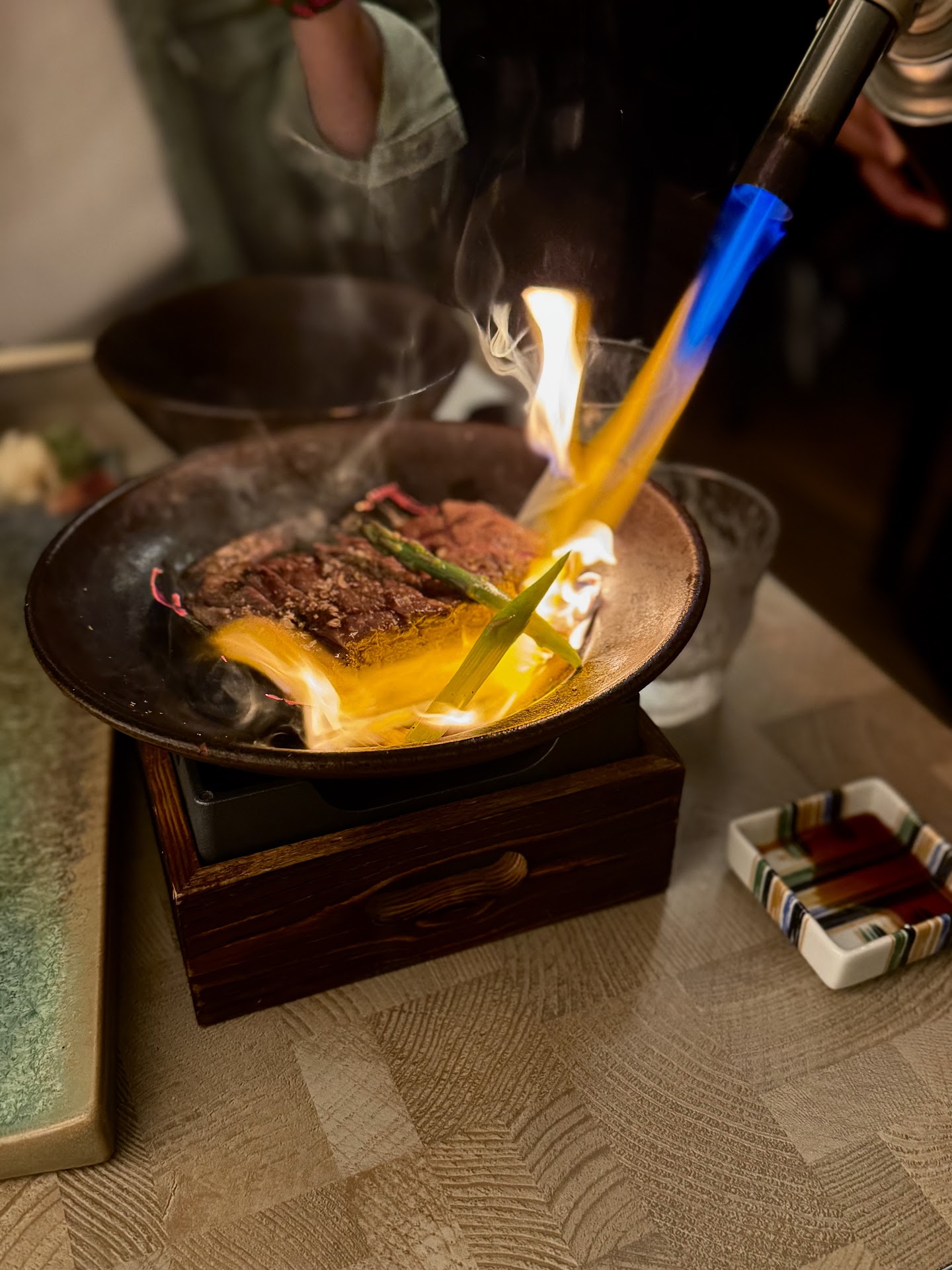 Flame searing wagyu at the table at Izakaya Mitto